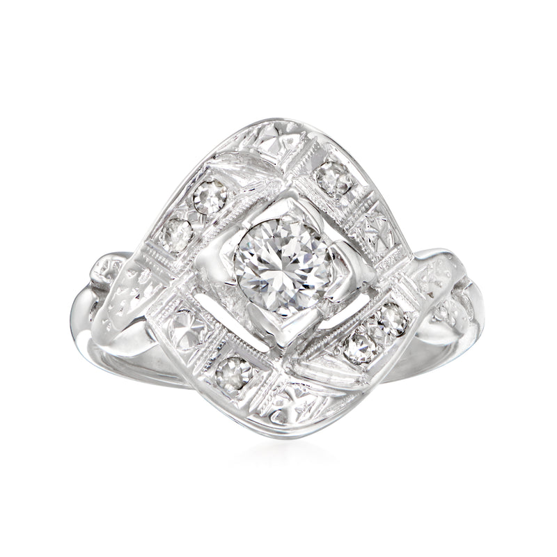 Vintage 14kt white gold diamond ring with round center stone and small side diamonds