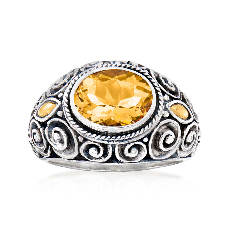 Sterling silver citrine ring with oval yellow gemstone and ornate Bali-style frame
