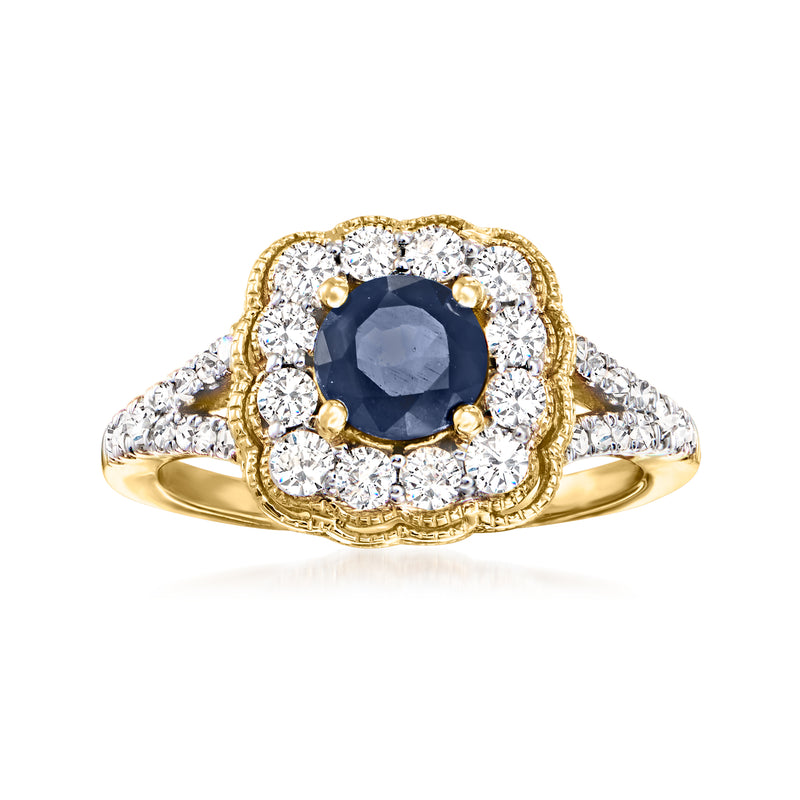 14kt yellow gold ring with dark blue sapphire and diamond halo