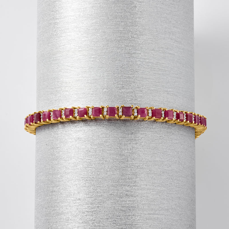 Ruby tennis bracelet with gold prong setting and secure clasp, diamond accents.