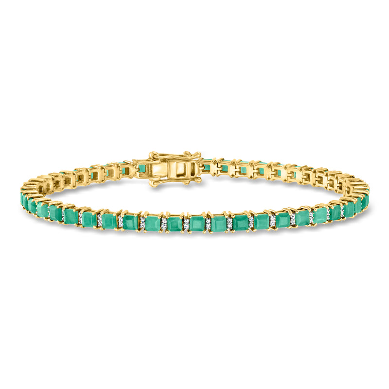 Gold tennis bracelet with lined green emerald stones and open-link border, secure clasp.