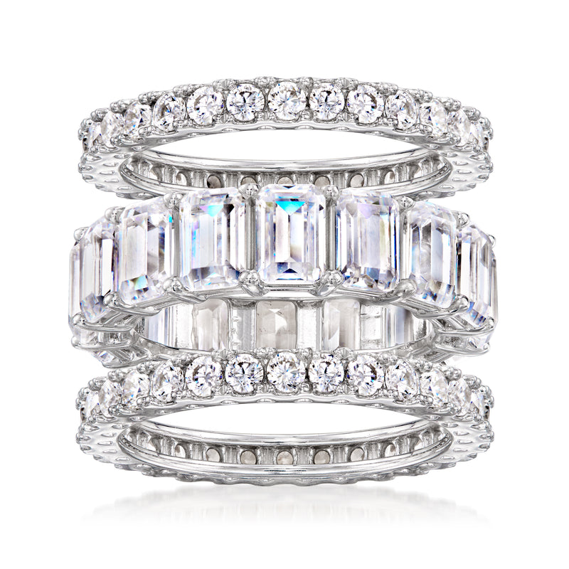 Three sterling silver CZ eternity bands stacked, with round and baguette-style stones
