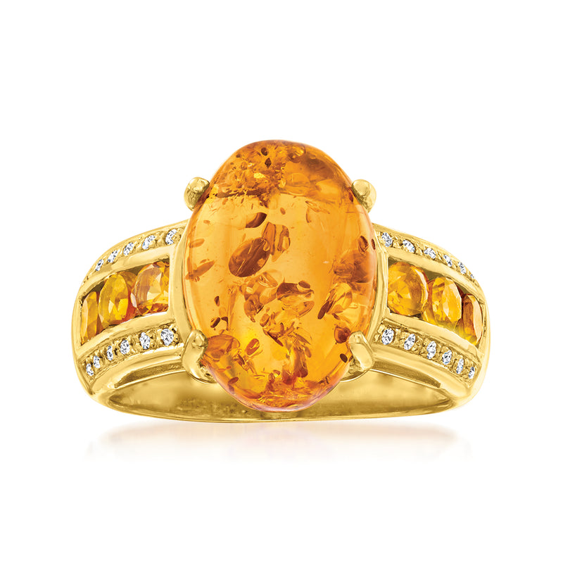 Gold over sterling ring with large oval amber-colored gemstone and diamond-like side stones