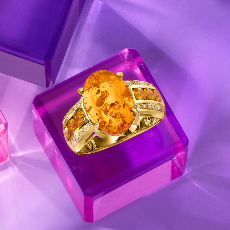 Oval amber-colored gemstone ring in gold over sterling with bright side stone accents
