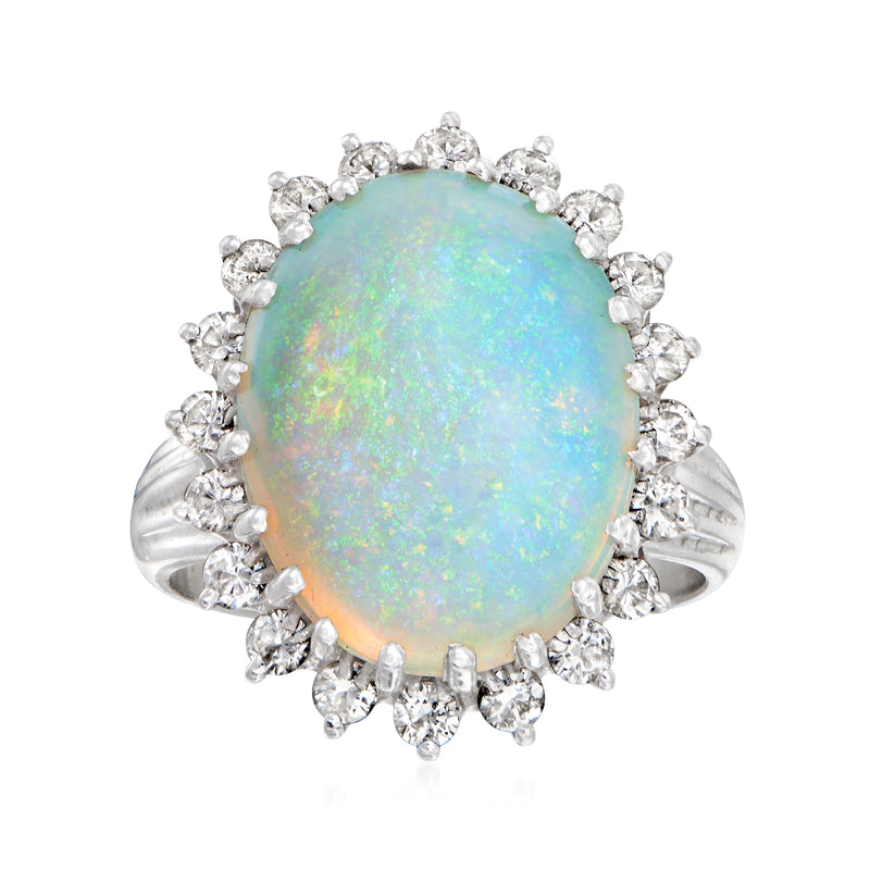 Oval opal cabochon diamond halo ring in 14kt white gold