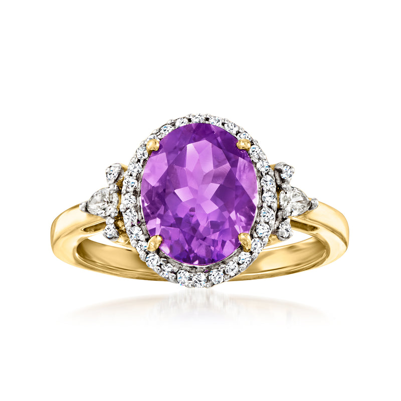 Oval amethyst and diamond halo ring in 14kt yellow gold