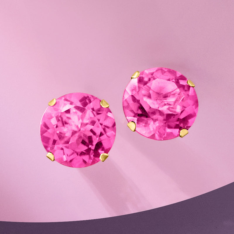 Pair of pink topaz stud earrings, 14kt yellow gold prong-set round gemstones