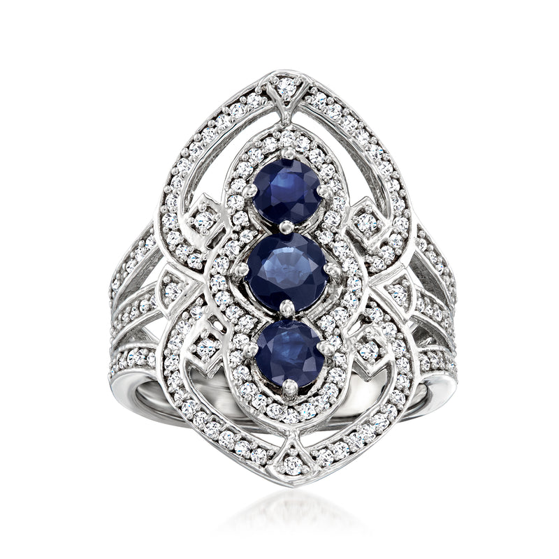 Sterling silver ring with two oval blue sapphires and diamond halo accents