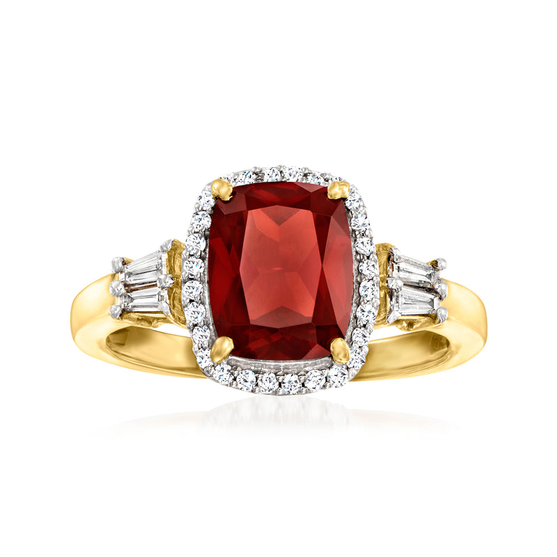 14kt yellow gold ring with cushion-cut red garnet center and diamond halo and side stones
