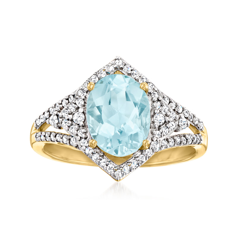 Aquamarine and diamond ring in 14kt yellow gold with oval halo setting