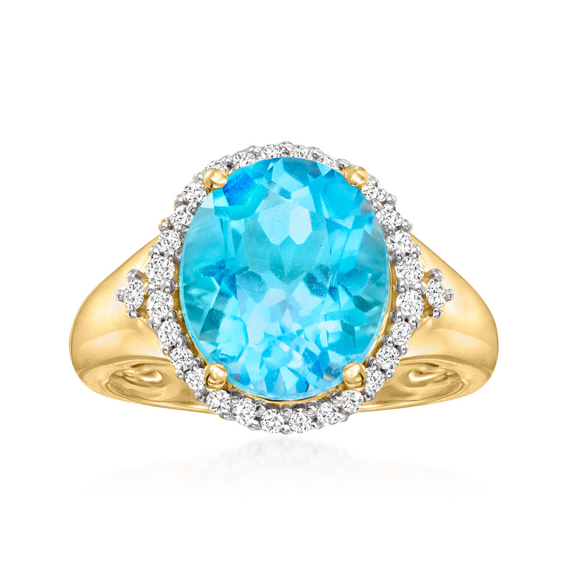 14kt yellow gold ring with oval Swiss blue topaz and diamond halo, round diamond accents