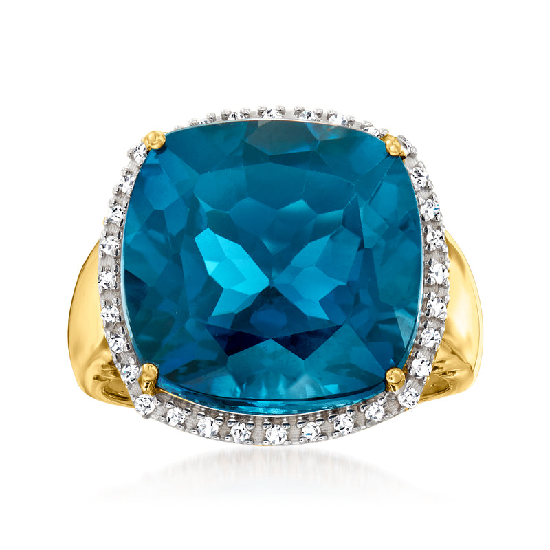 14kt yellow gold ring with large London blue topaz, diamond halo and prong setting