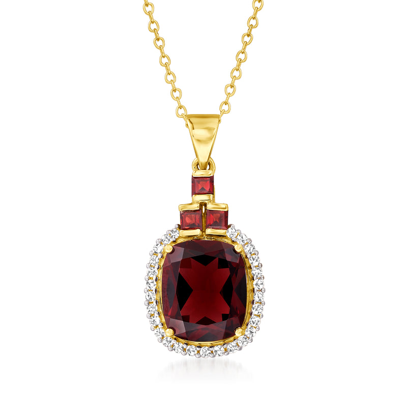 14kt yellow gold pendant necklace with oval garnet center and diamond halo