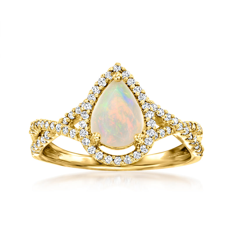 18kt yellow gold teardrop opal ring with diamond halo and curved band