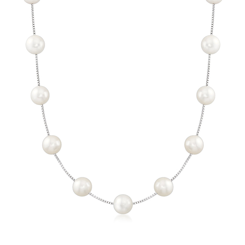 Sterling silver station necklace with six round cultured white pearls on a fine chain