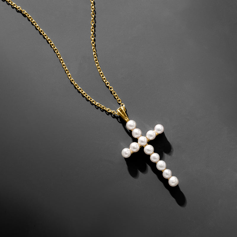 Gold cross pendant necklace with dangling white pearls and bead chain