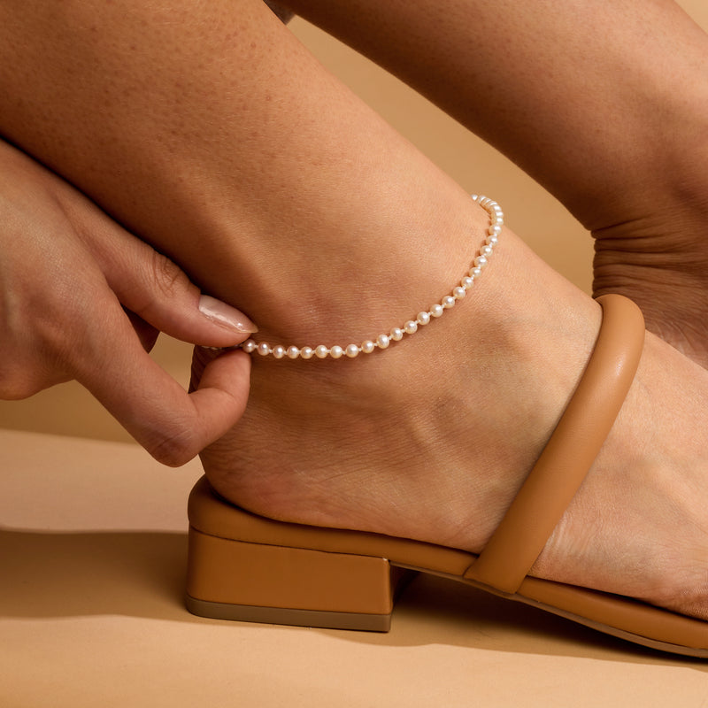 Cultured pearl anklet with 4–4.5mm white pearls worn on an ankle