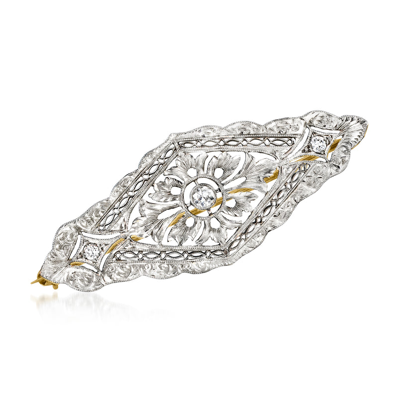 Vintage diamond filigree pin with round center stone, floral engraving in platinum and yellow gold