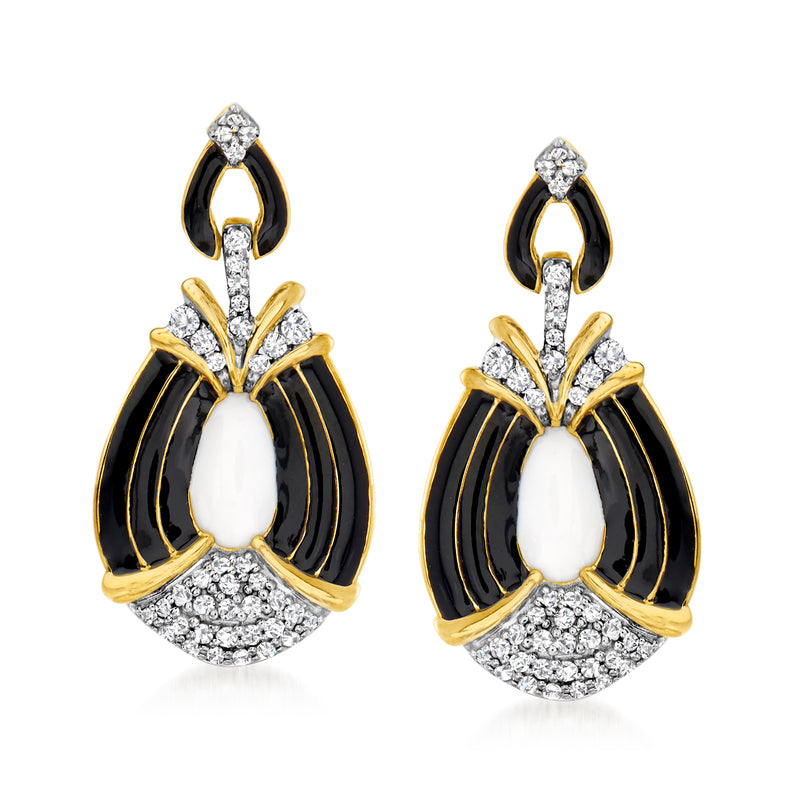 Gold-tone drop earrings with oval white and black enamel, surrounded by clear stone accents