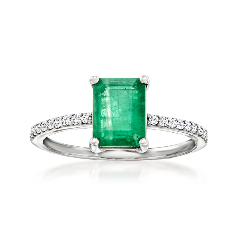 Emerald and diamond ring in 14kt white gold with emerald-cut green center stone