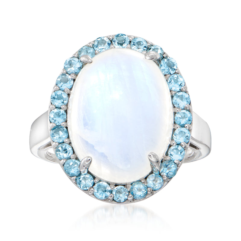 Oval moonstone ring in sterling silver with blue topaz halo and slim side bands