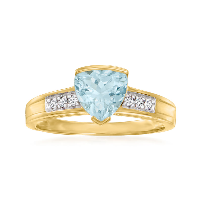 14kt yellow gold ring with oval aquamarine center and diamond accents on the band