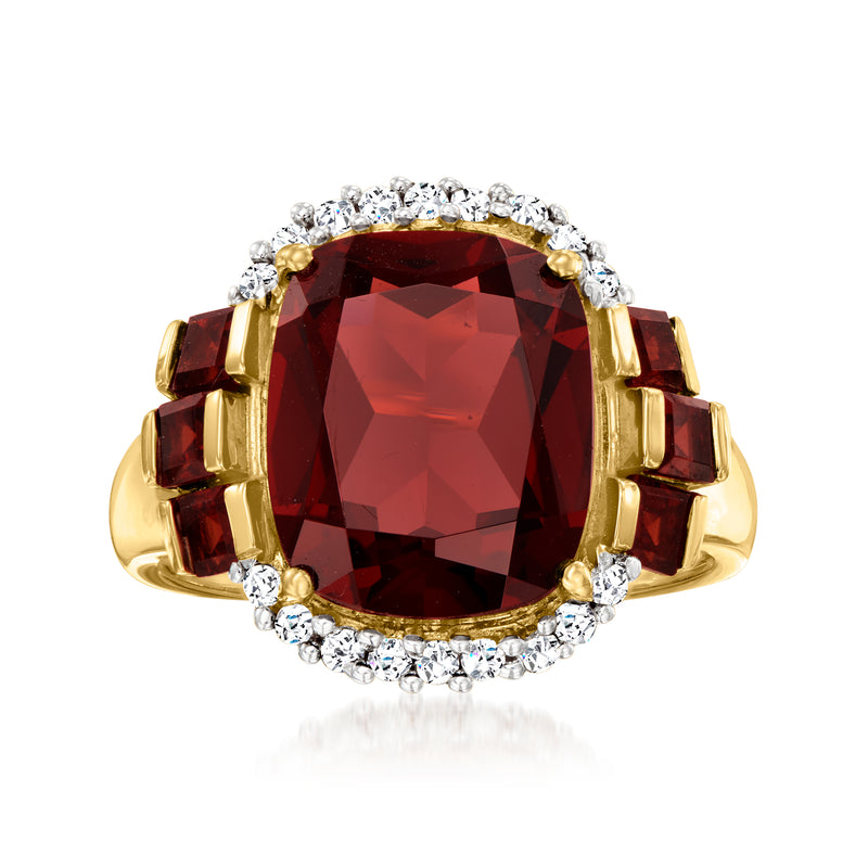 14kt yellow gold garnet ring with oval dark red center and diamond halo
