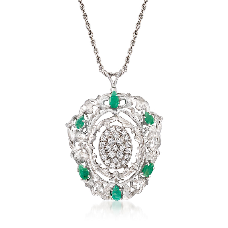 14kt white gold leaf pendant necklace with oval center diamond halo and green emerald accents