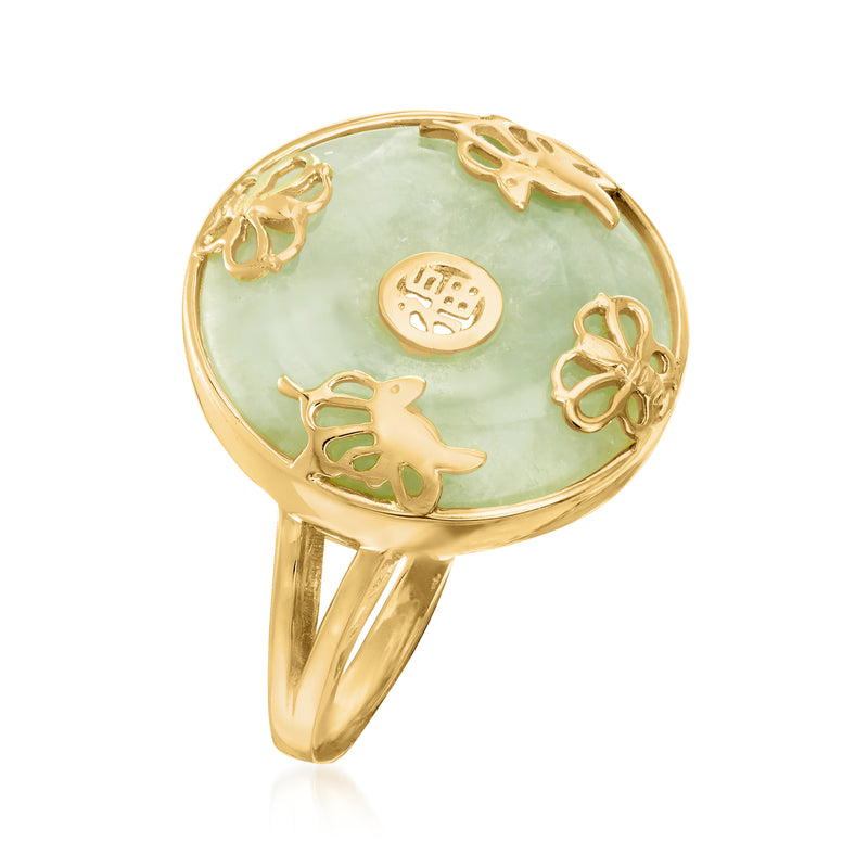 Gold-tone ring with jade-green oval face, butterfly and lucky coin details