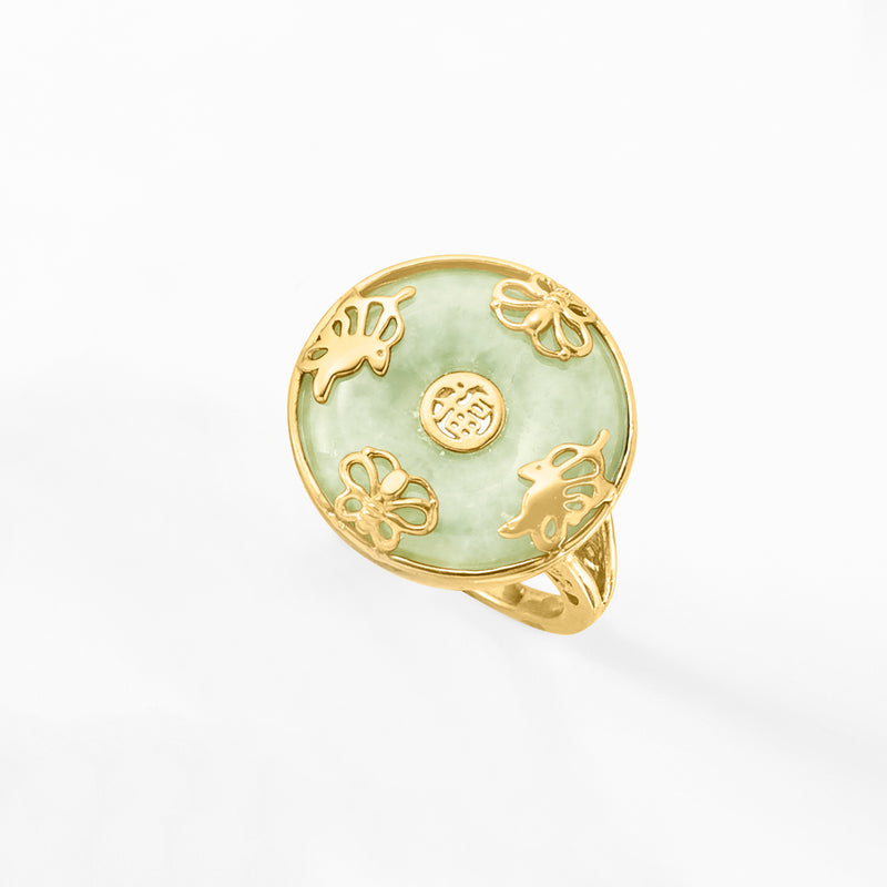 Jade-green oval butterfly ring, gold-tone band with four butterfly cutout motifs
