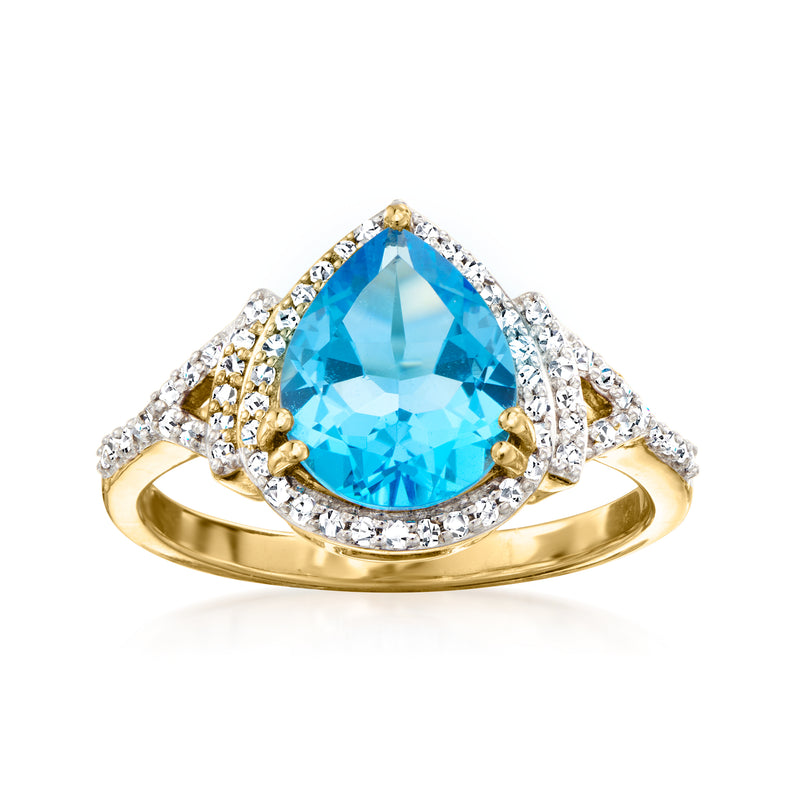 14kt yellow gold ring with oval Swiss blue topaz and diamond halo