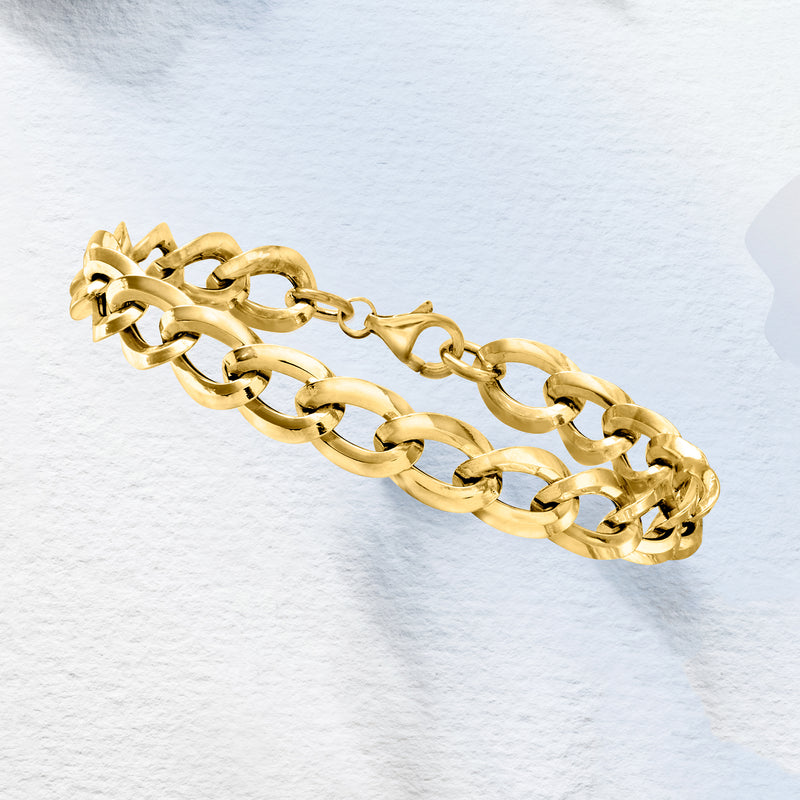 Yellow gold curb-link bracelet, clasp and link detail in side view