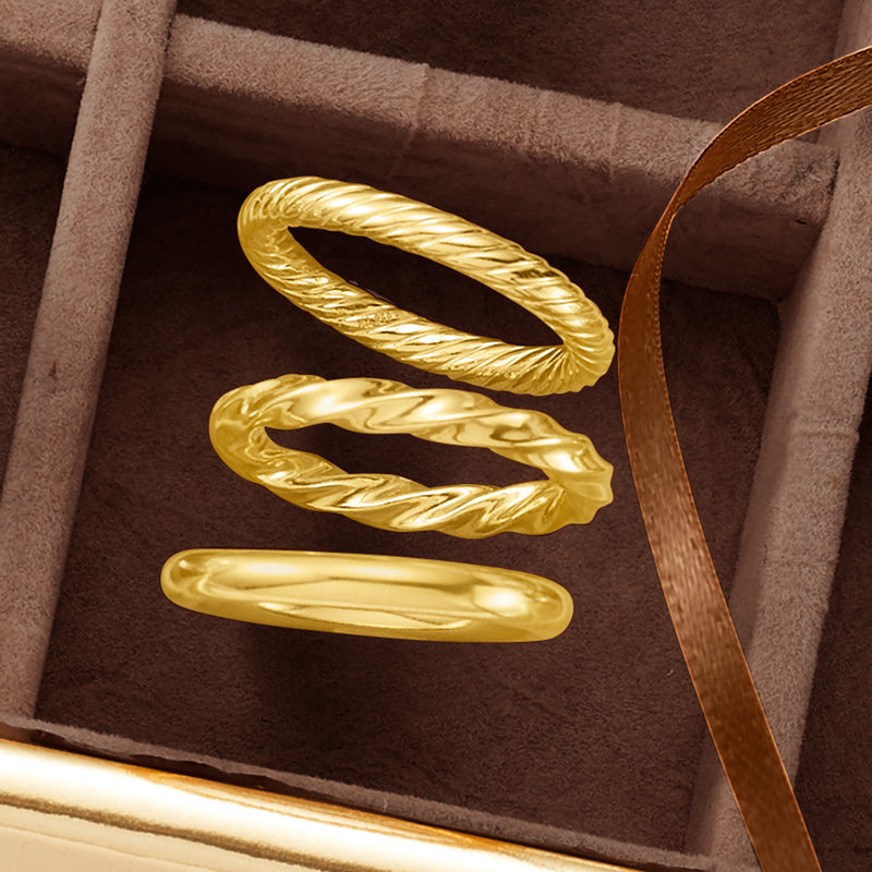 Gold over sterling three polished rings: smooth, ridged, and braided bands