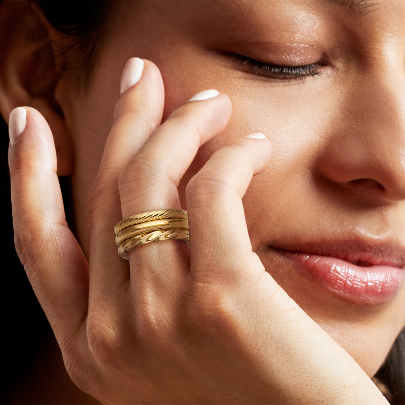 Gold over sterling three-ring set on hand: braided plus two smooth polished rings