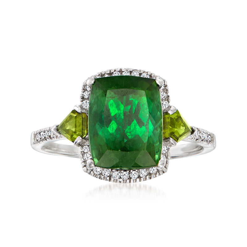 14kt white gold ring with emerald-cut green tourmaline center and diamond halo, side stones