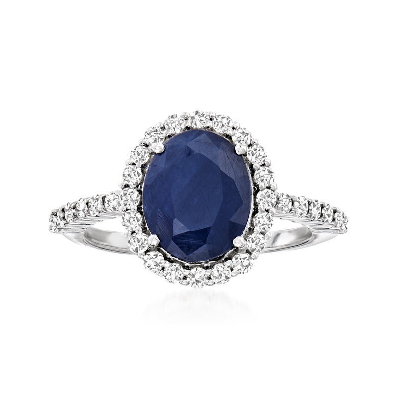Oval sapphire halo ring in 14kt white gold with round diamond accents