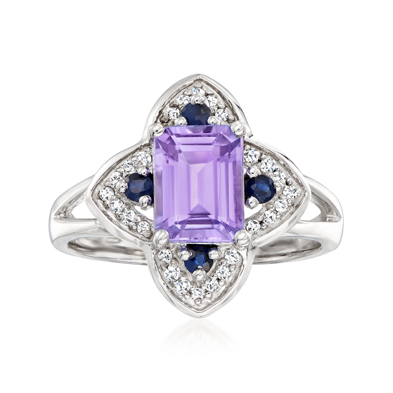Amethyst-colored emerald-cut gemstone ring in 14kt white gold with diamond accents and blue stones