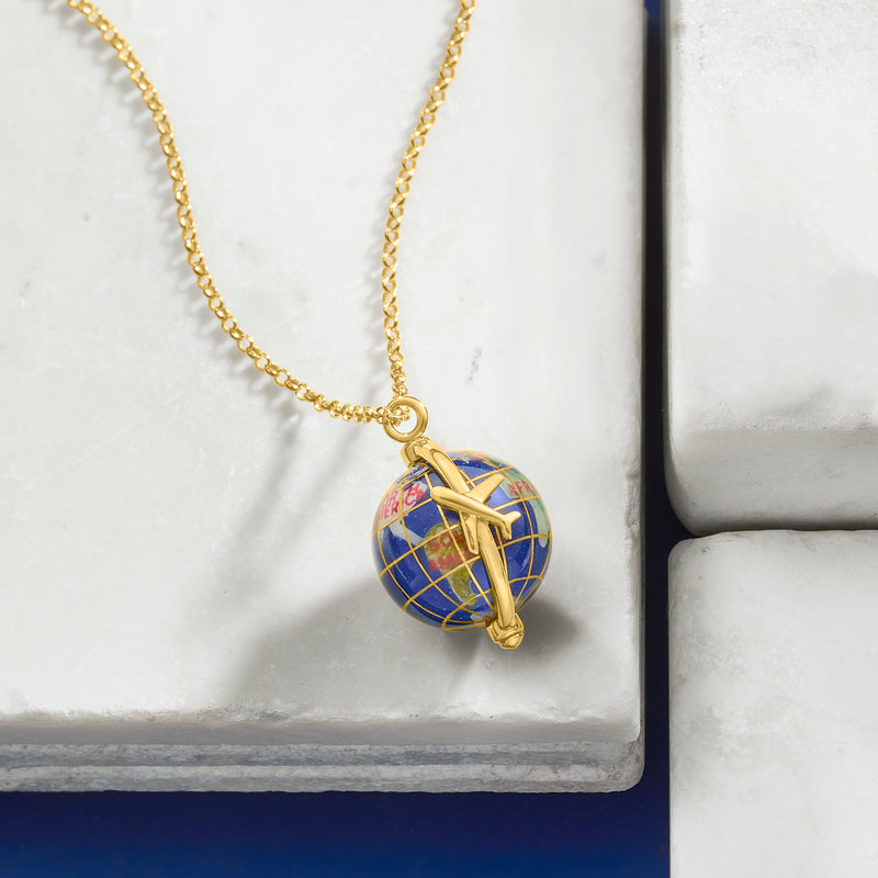 Gold-tone globe pendant necklace with blue grid map and looping star overlay