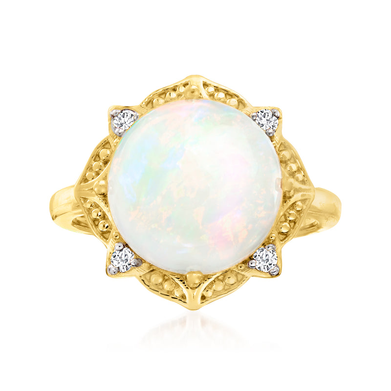 Opal and diamond ring in 14k yellow gold with oval opal and side diamond accents