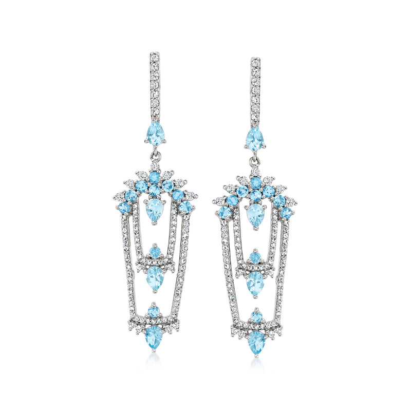 White gold drop earrings with sparkling diamonds and oval aquamarine blue center stones
