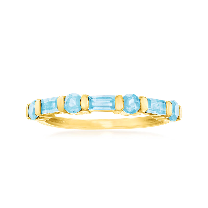 14kt yellow gold ring with blue topaz baguette and round stones across the band