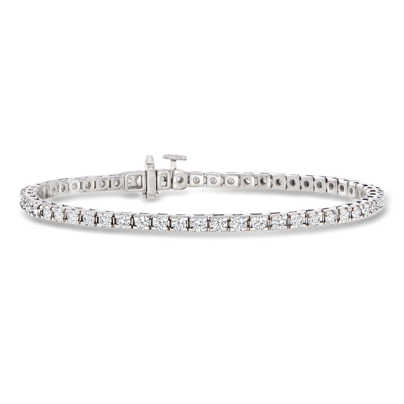 Sterling silver diamond tennis bracelet with round stones, hinged clasp