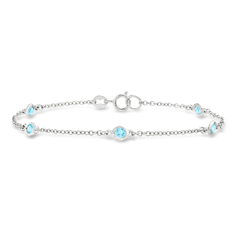 Sterling silver station bracelet with bezel-set Swiss blue topaz stones and chain links