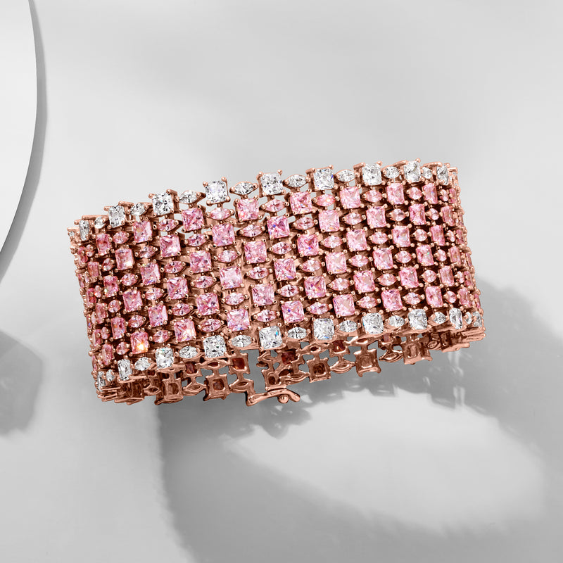 Pink and white CZ wide tennis bracelet in rose gold over sterling, side view.