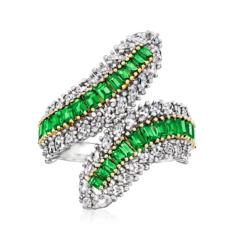 Two-tone bypass ring in sterling silver with green emerald-cut center and clear CZ accents
