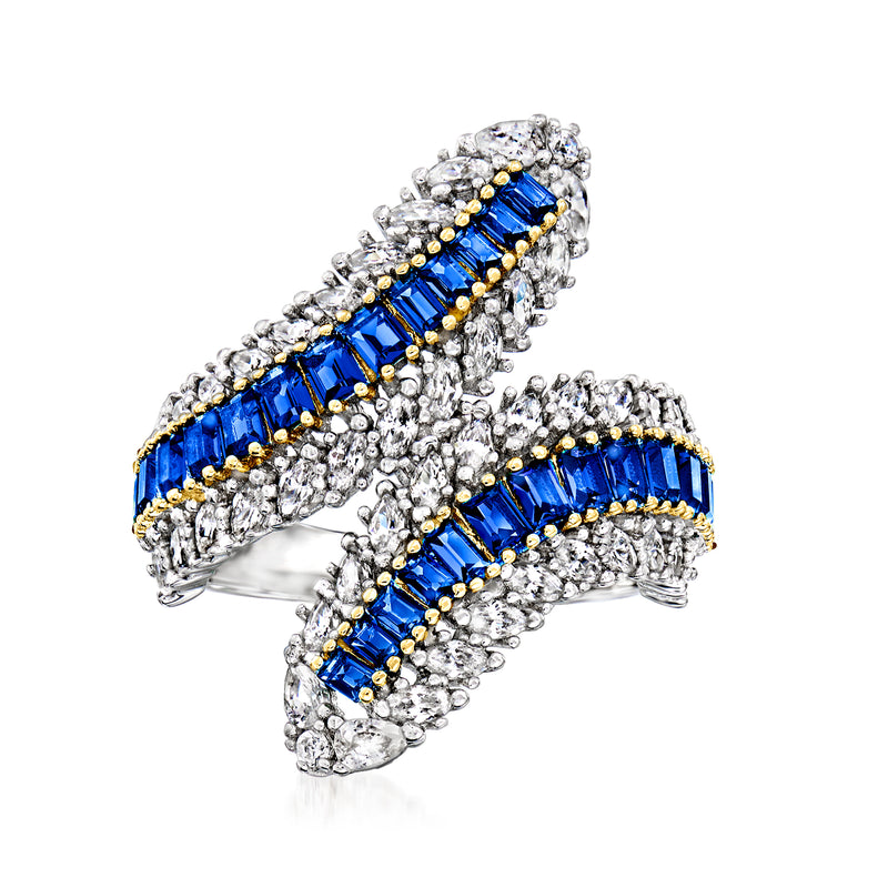 Two-tone sterling silver bypass ring with blue simulated sapphire-style stones and clear CZ