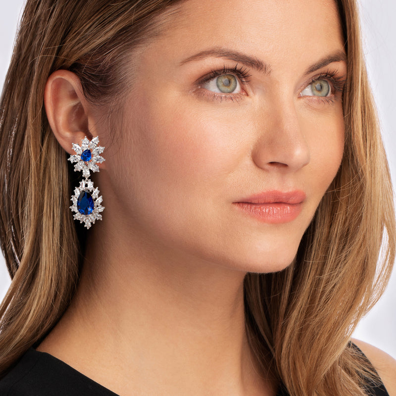 Blue teardrop drop earrings with CZ snowflake motifs on sterling silver