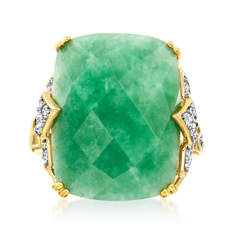 Two-tone sterling silver ring with large oval green zircon center and diamond-like side stones