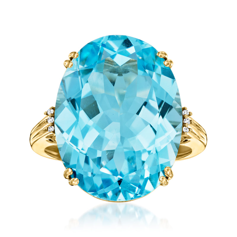 Oval sky blue topaz ring in 14kt yellow gold with diamond accents on the band