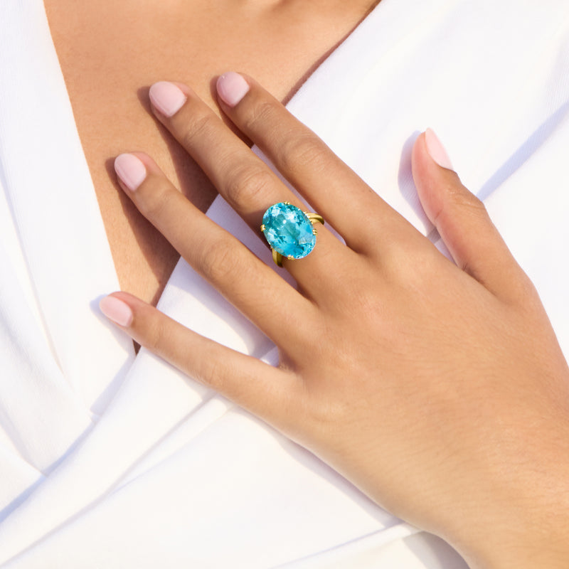 Sky blue topaz statement ring with diamond accents in 14kt yellow gold, oval center stone
